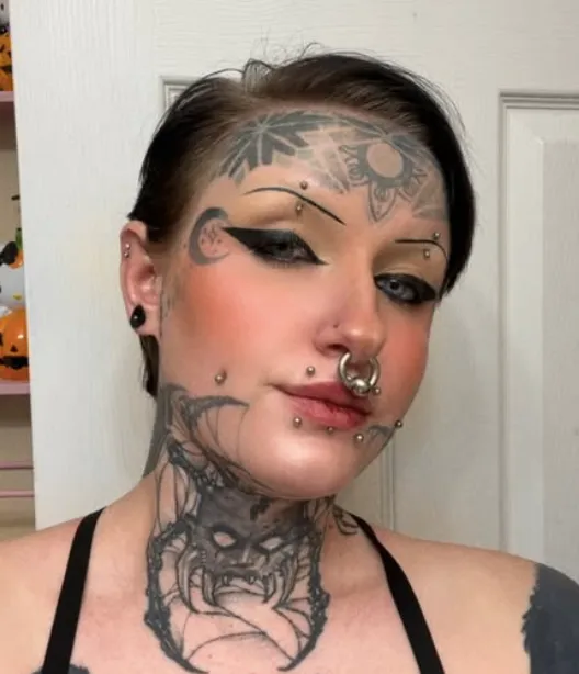 California Woman Claims She Was Rejected from TJ Maxx Job Due to Face and Neck Tattoos