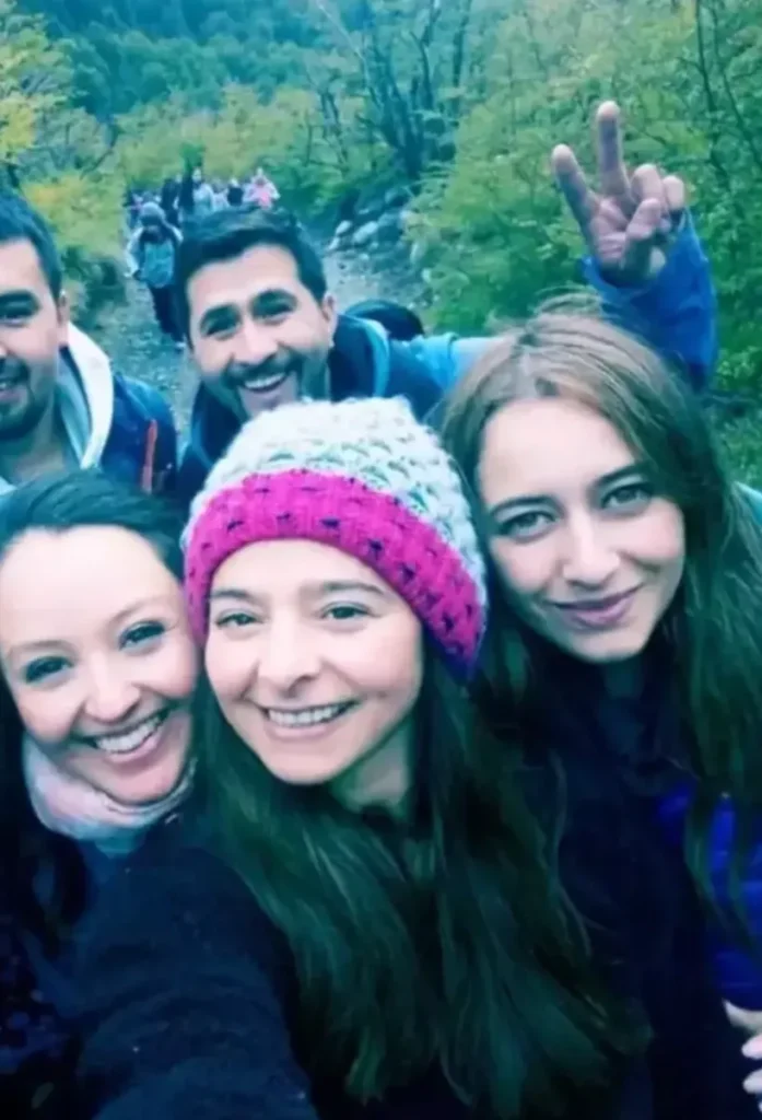 This regular photograph of six people hiking 