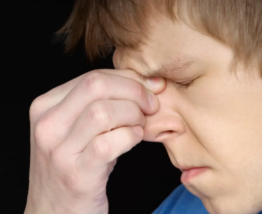 show discomfort or anxiety through nose touching